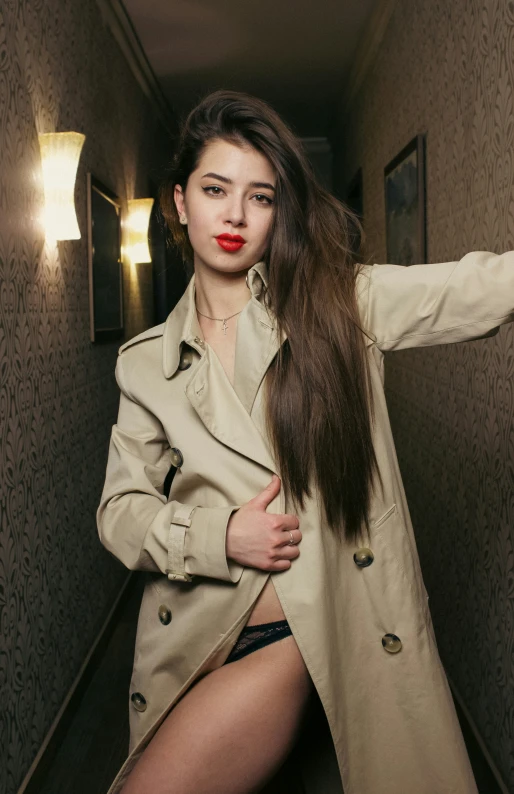 a woman with her long hair standing in a room