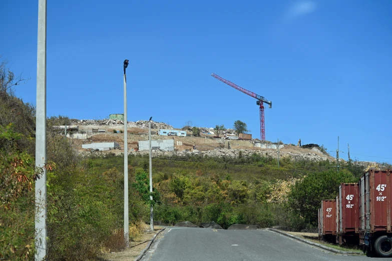 a construction site near the road with vehicles