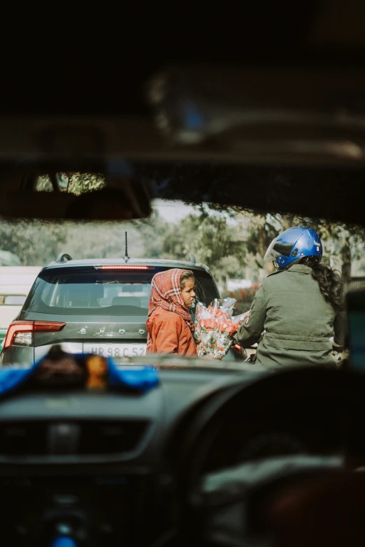 two women in a car on a city street