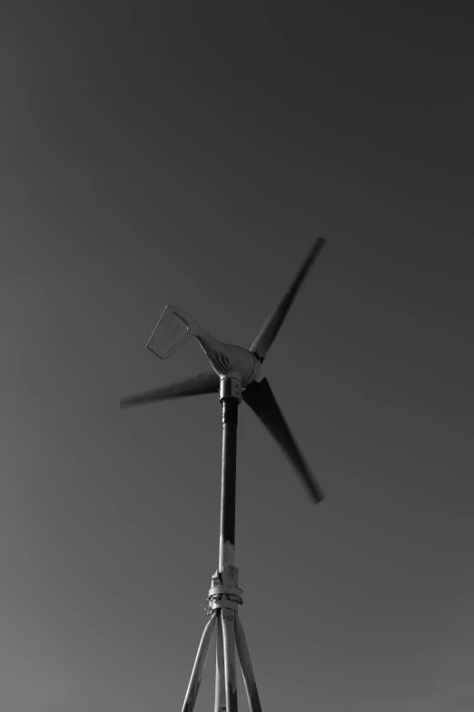 a wind turbine that is next to an airplane