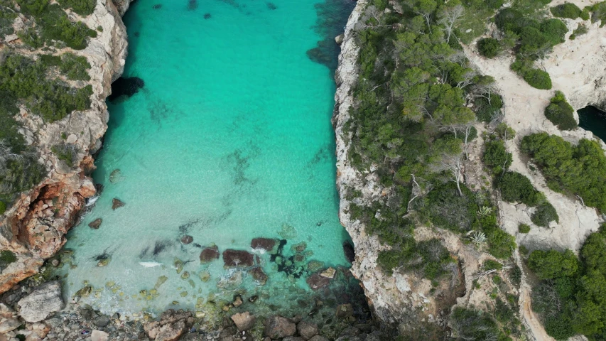 water at the end of three large cliffs