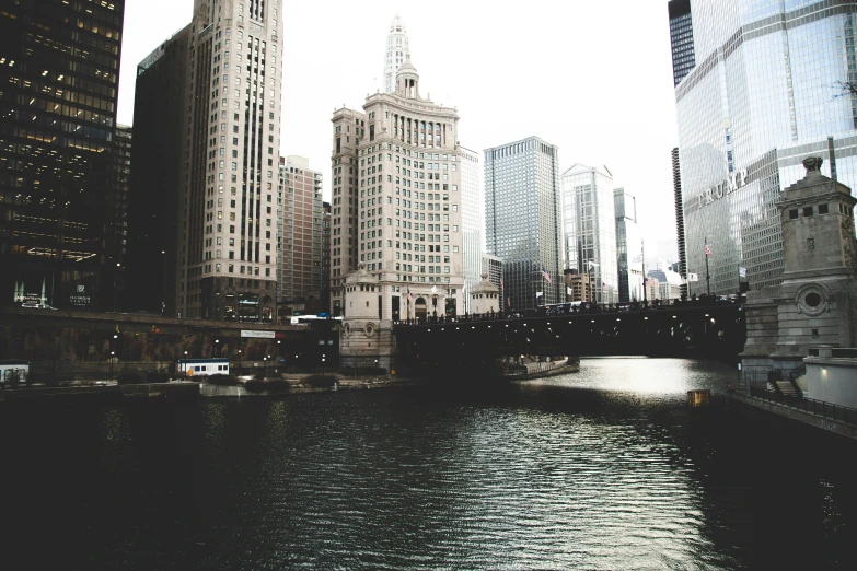 a body of water near some very tall buildings