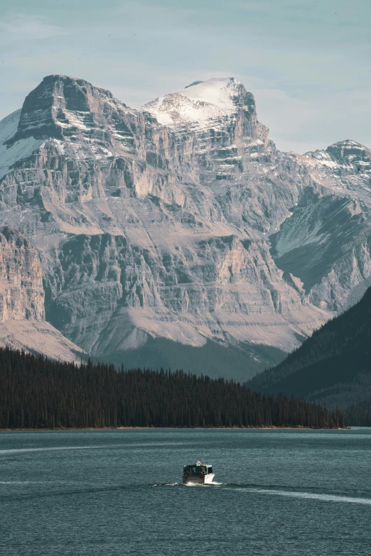 boat in the water near large mountain range