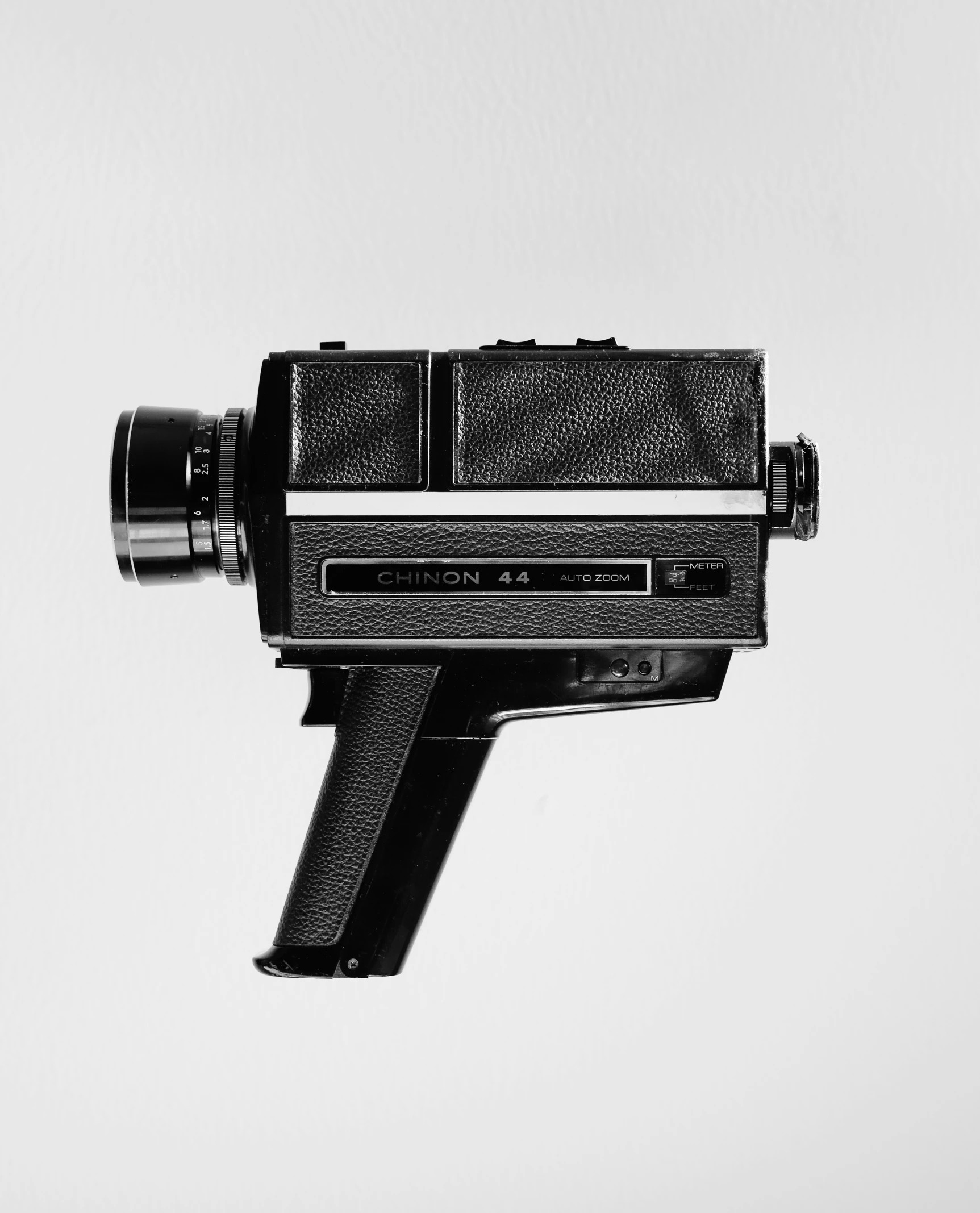 a black and white image of a camera with a white background