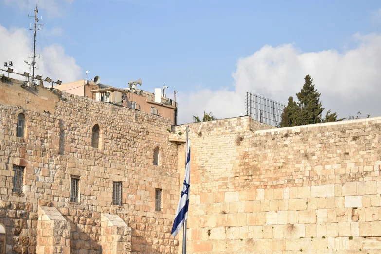 some very tall walls with the building at one end