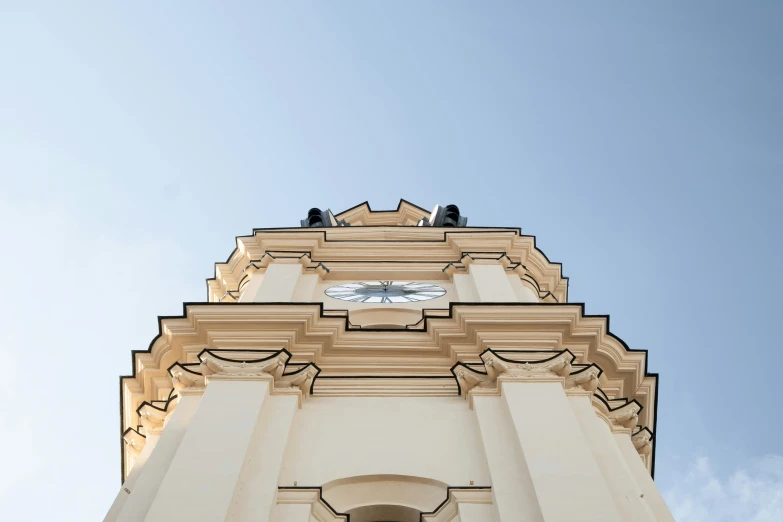 a clock on the side of an arched building