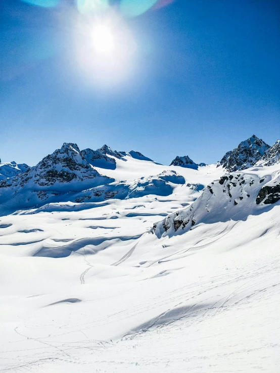 a person skis on a snow covered mountain