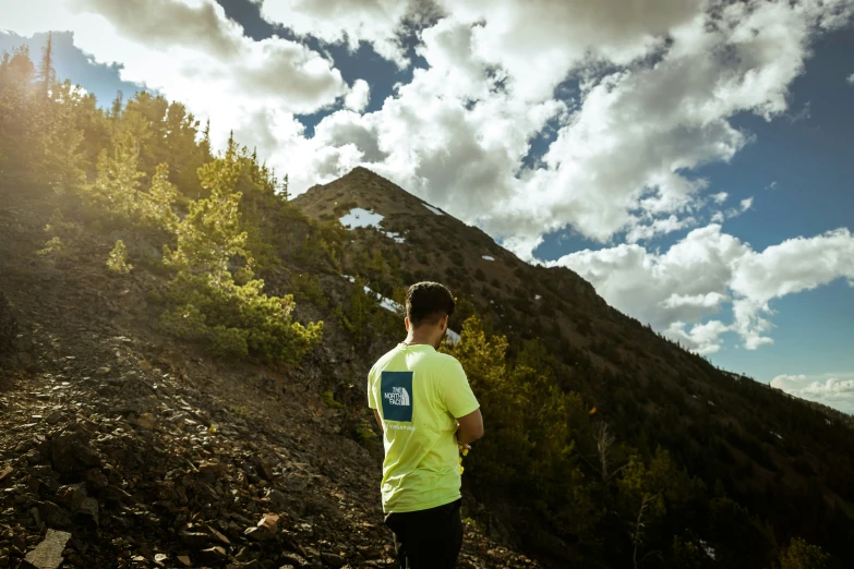 a man is running on a mountain top