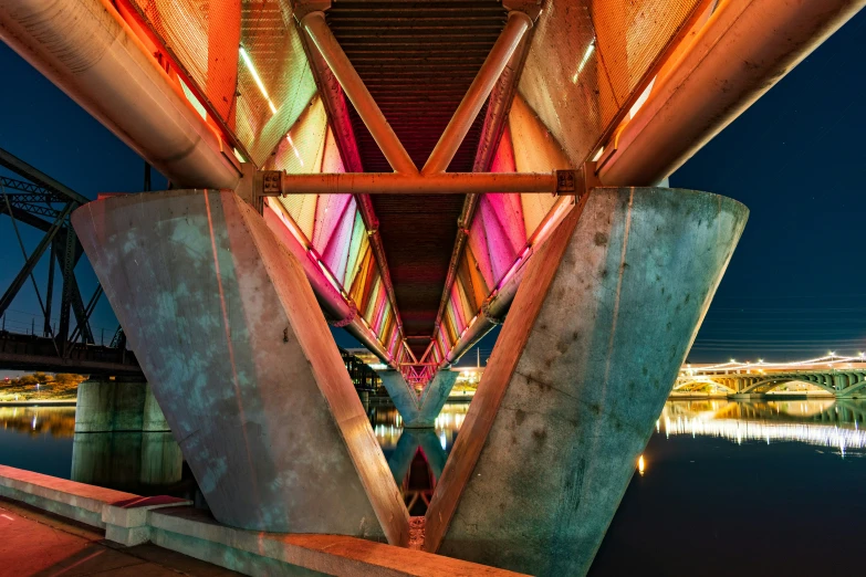 an abstract po of the underside of a bridge at night