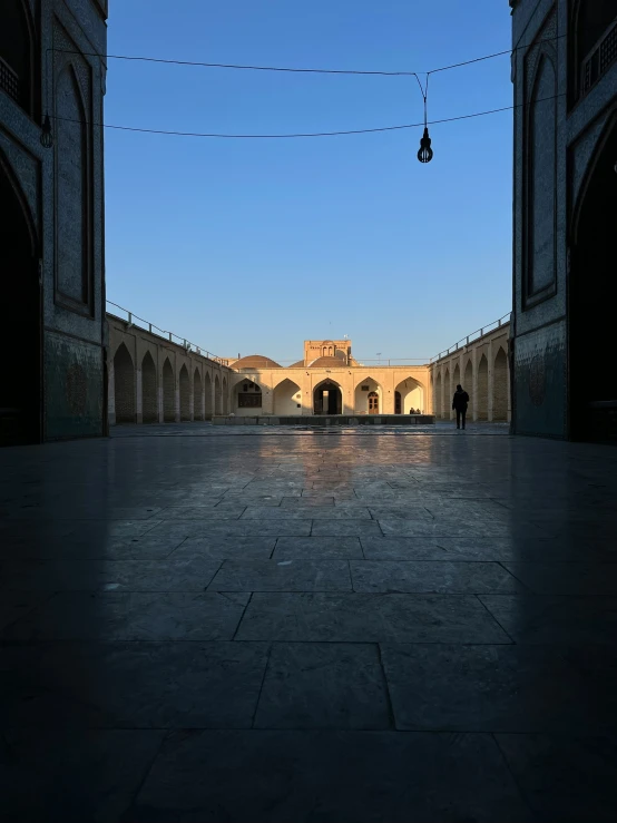 a group of people sitting in a long building