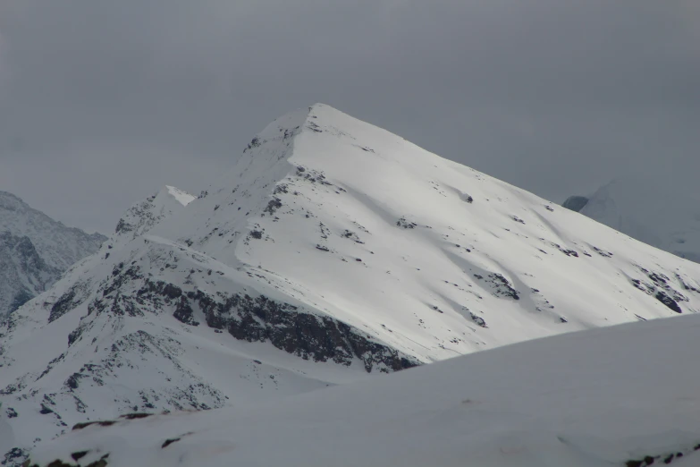 a big mountain with some snow on it