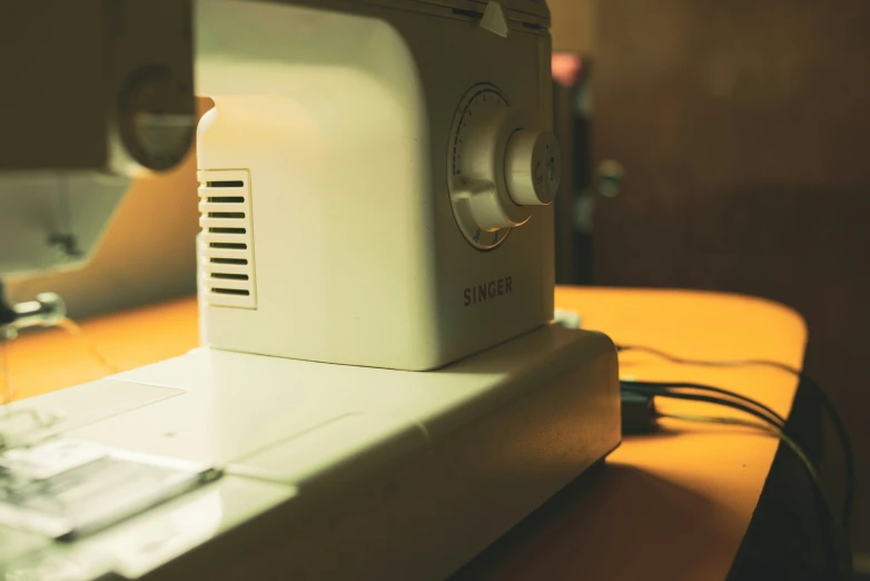 a sewing machine on a table on a sunny day