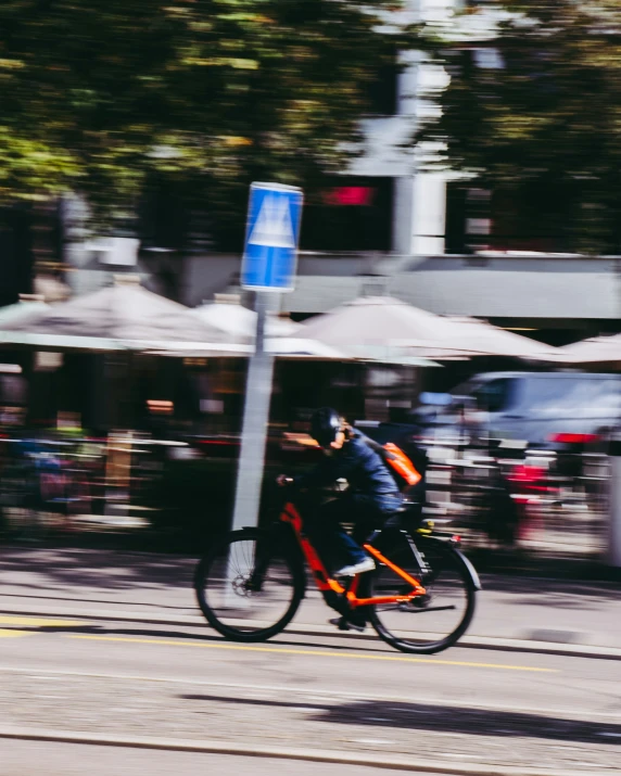 two bikers are riding on the same street