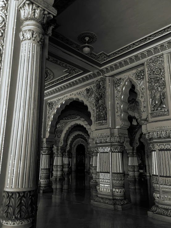 an ornate interior of a building with arches and columns
