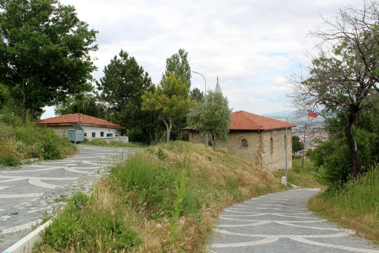 pathway leading to the small village with several rooms on each side