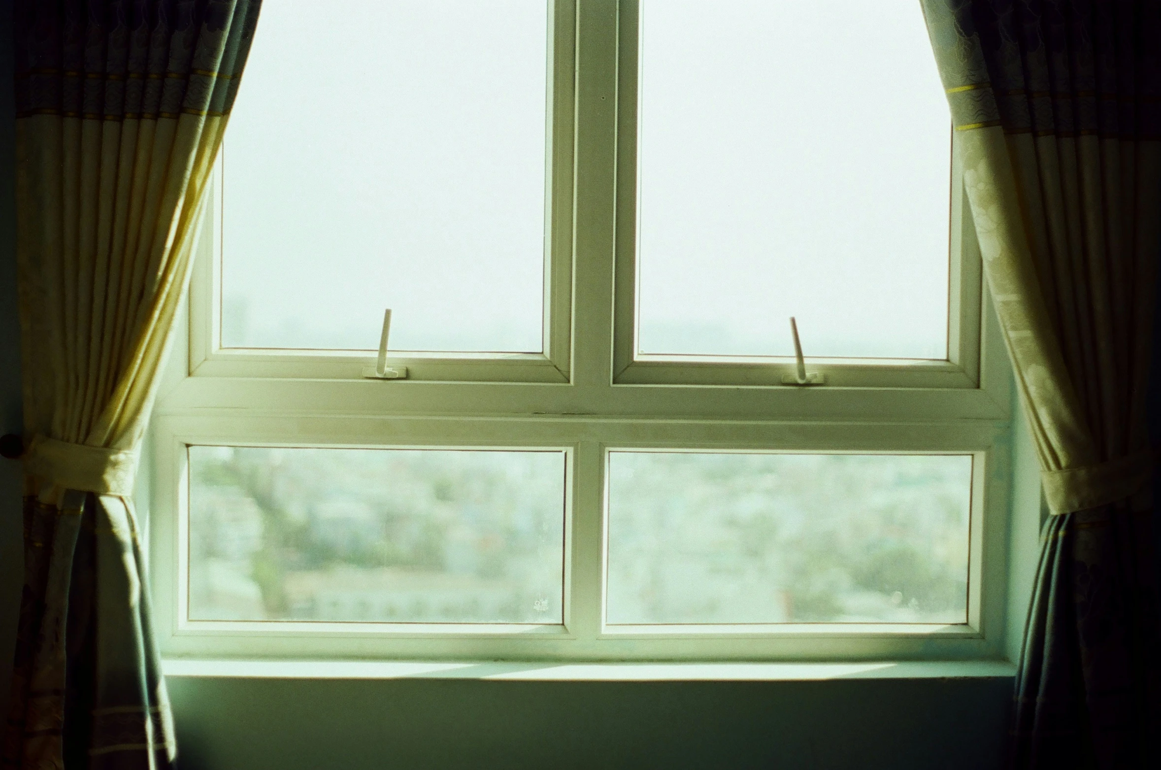 a window with some pins hanging on it