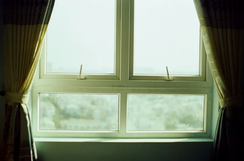 a window with some pins hanging on it