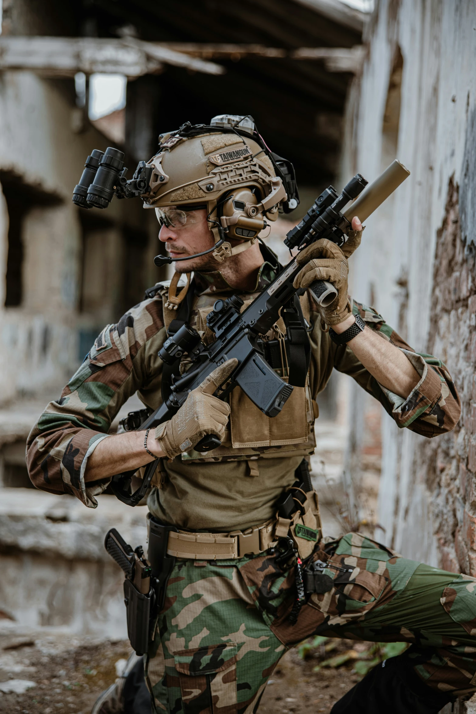 a man with an automatic rifle in camouflage