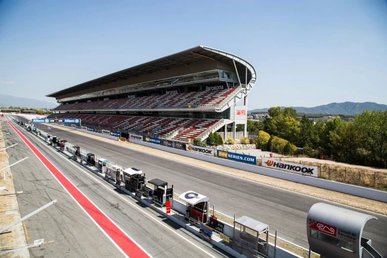 a race track with many spectators inside a stadium