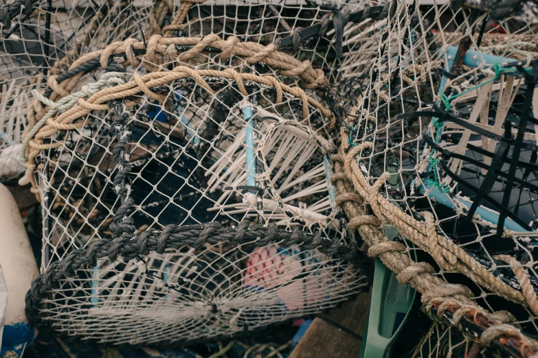 a pile of fishing nets piled together on the ground
