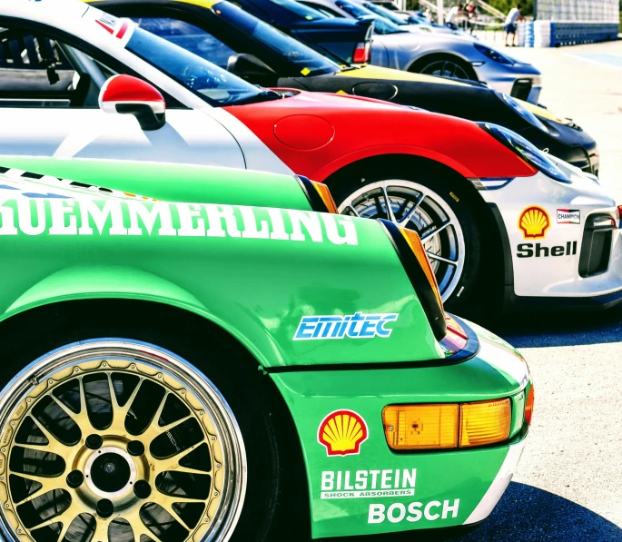 a collection of sports cars parked together in a row