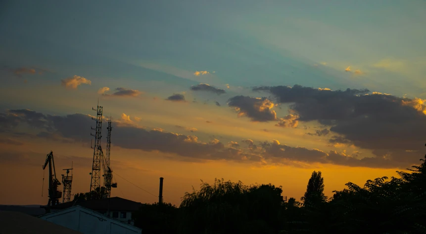 a very pretty sunset with a bunch of clouds