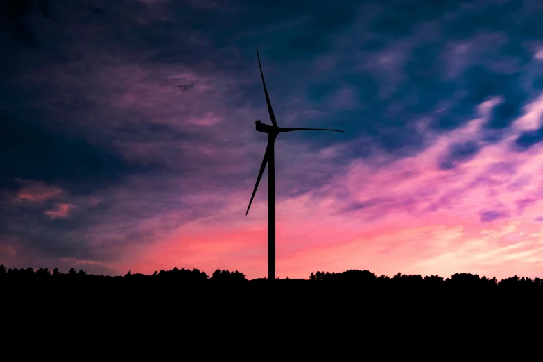 this is a wind farm at sunset