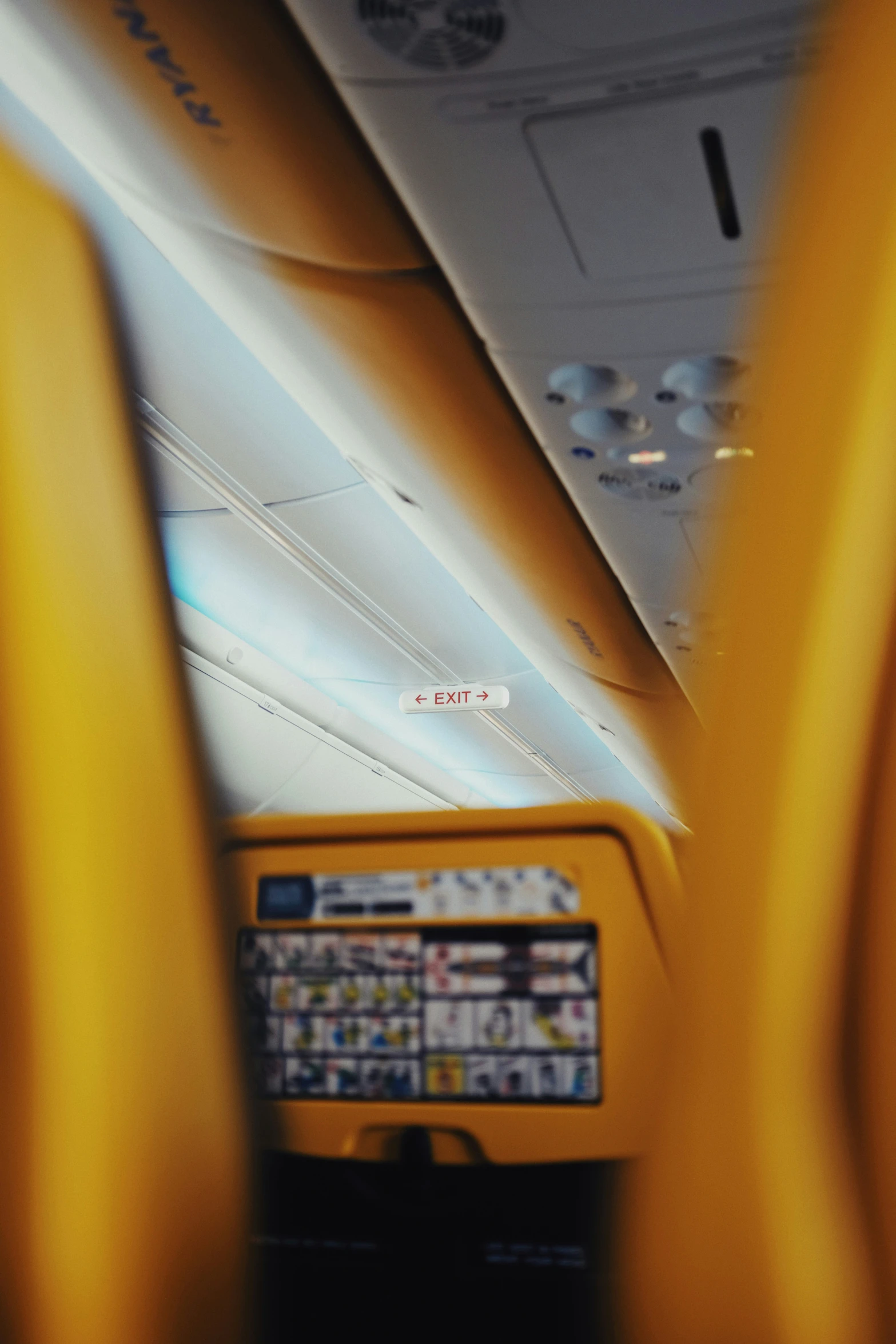 the interior of a plane with its overhead windows