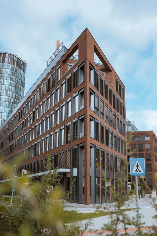 a building with many windows and a blue sign