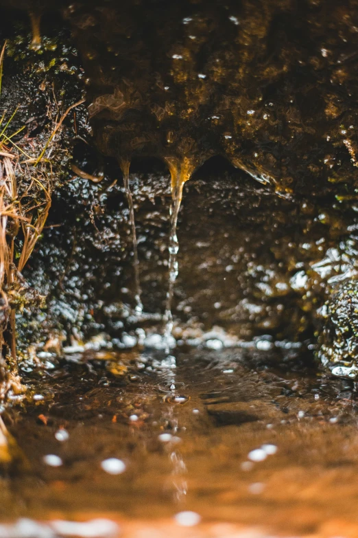 water rushing over a sidewalk in the rain