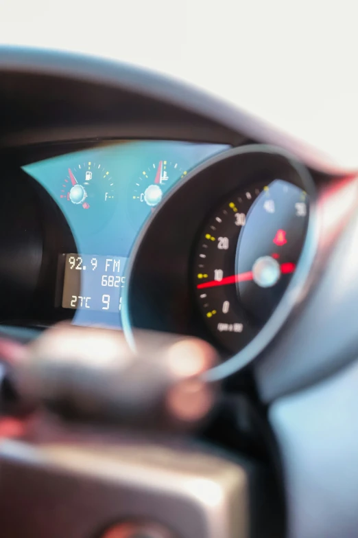 dashboard showing a few different gauges with speed and mileage