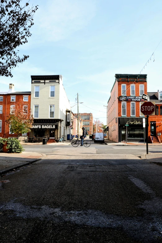 the corner of a city street with a stop sign