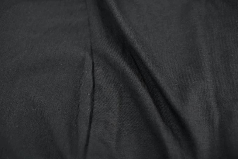 closeup of dark black fabric with fine linen