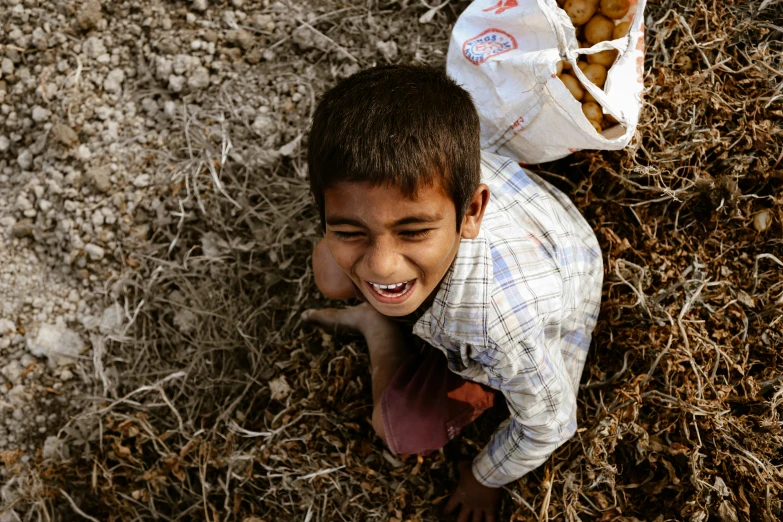 a  laying in the grass and smiling