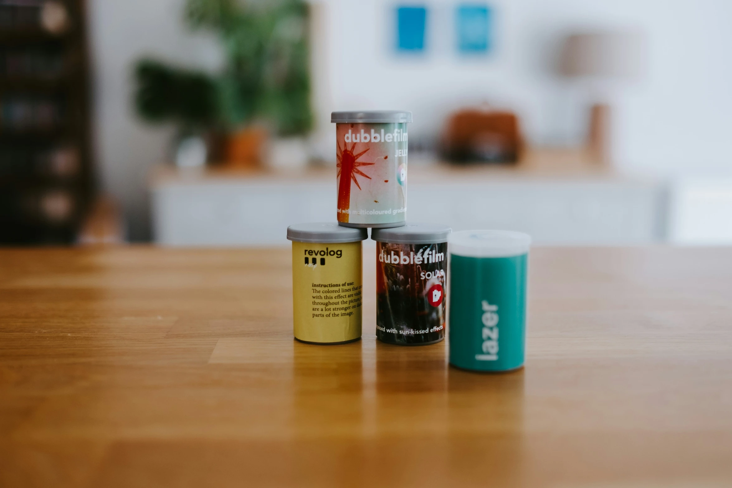 four small cans are sitting on the table