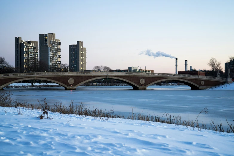 bridge spanning the width of a frozen body of water