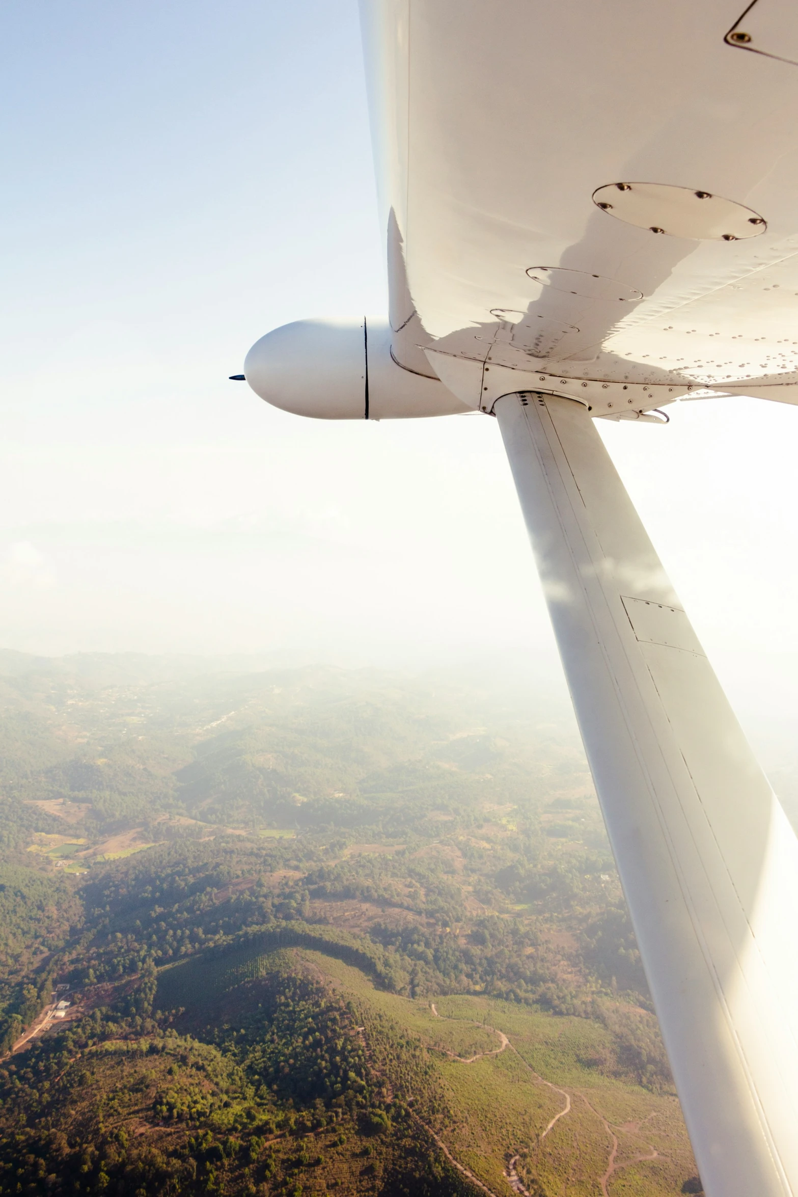 view of mountains from the cockpit of a plane