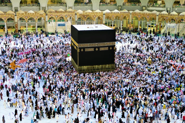 a large group of people gather around the kabab in the middle of a crowd