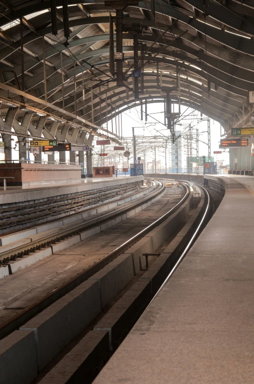 an empty subway station with a sky view