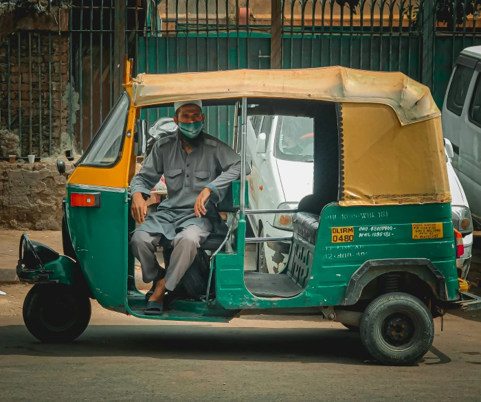 a man in an electric vehicle in a parking lot