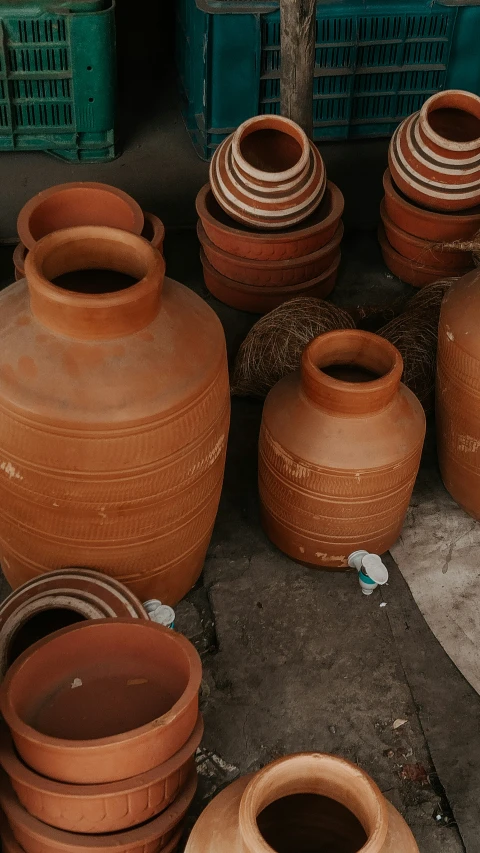 there is a lot of clay vases that have been placed