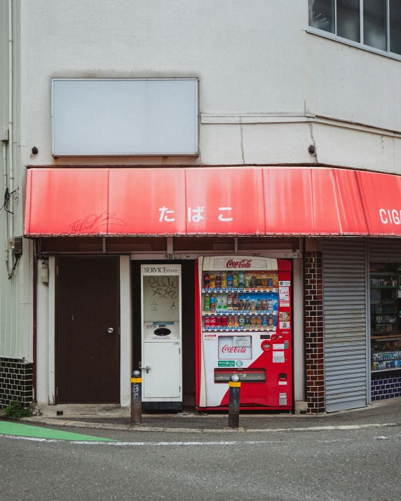 a red and white business on the corner of an intersection