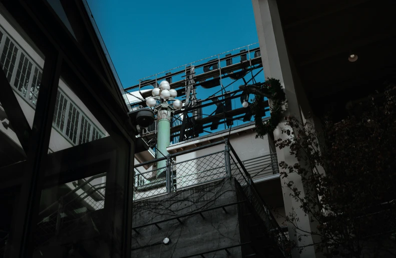 a street light hanging above a set of stairs