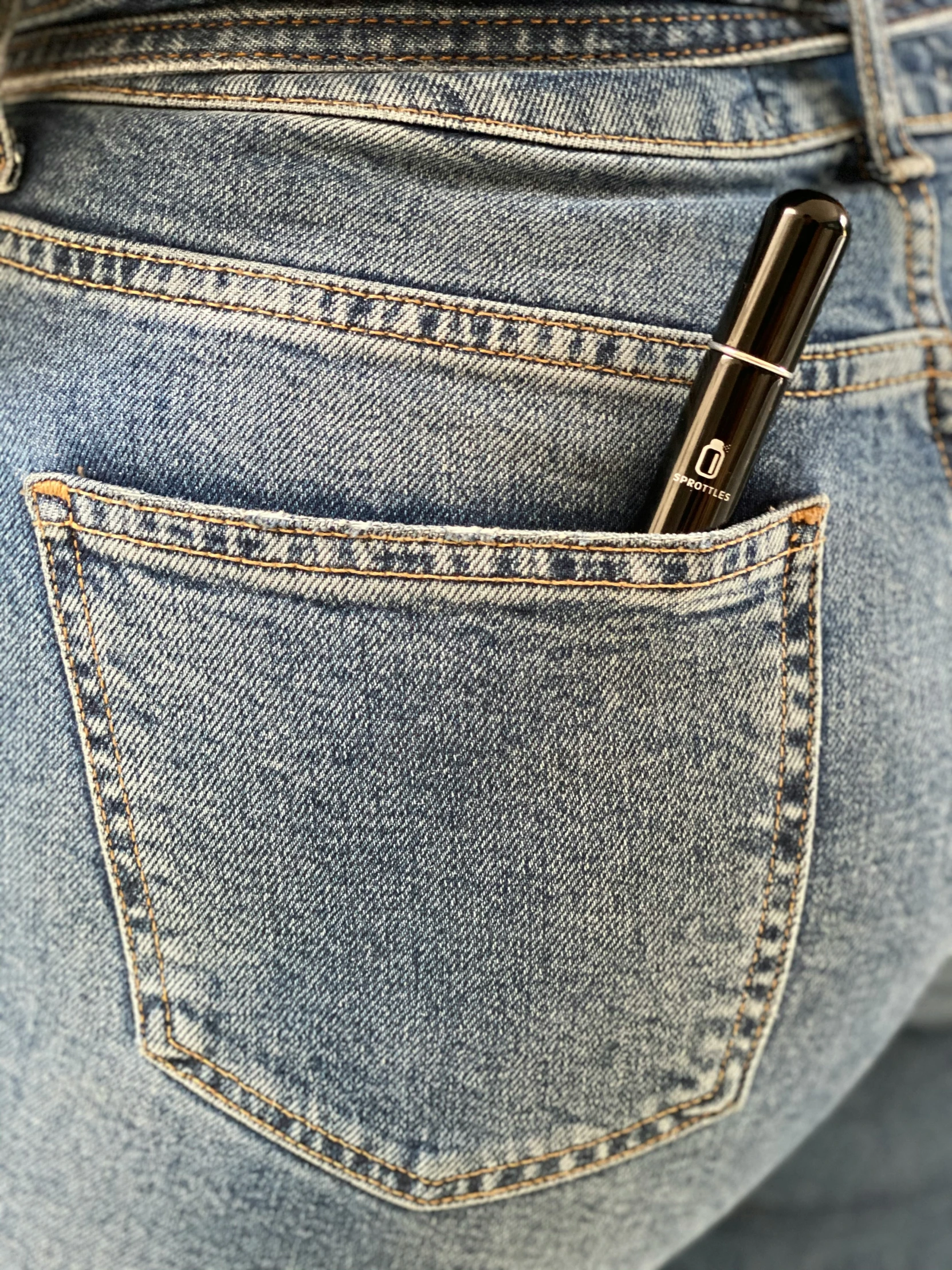 a pen in the pocket of someones jeans