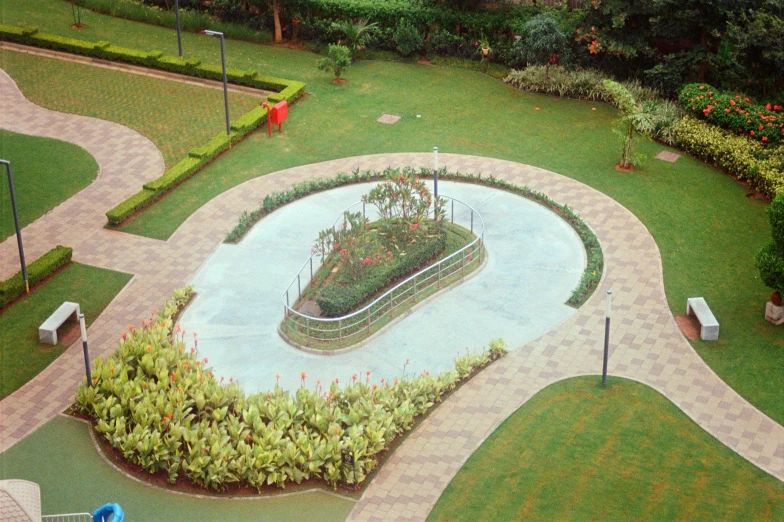 aerial s of garden with paved path and benches