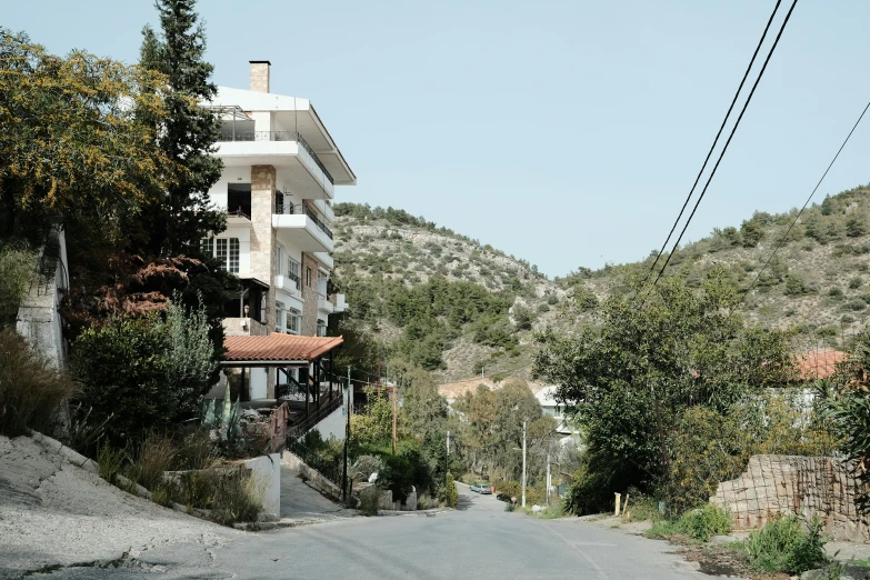 an old, dirt - paved street in the mountainside