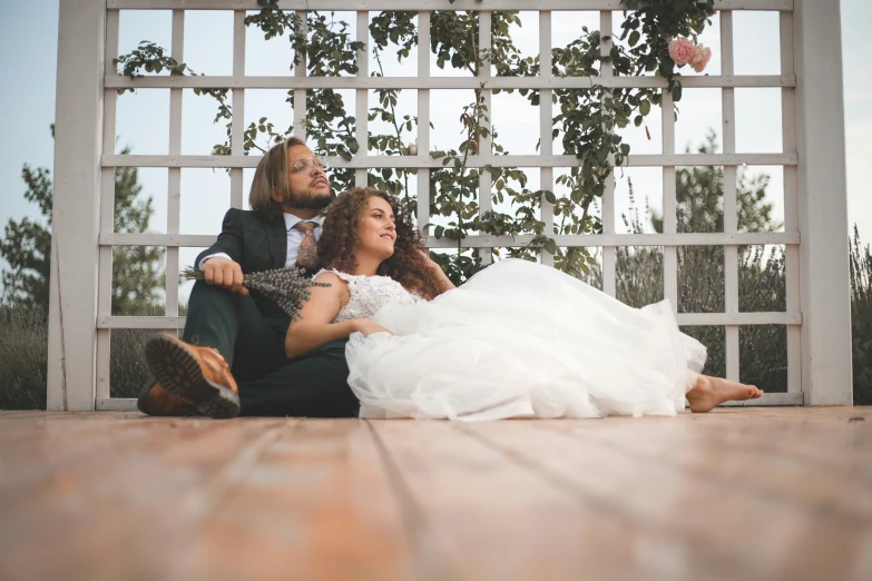 two women and one man on the ground