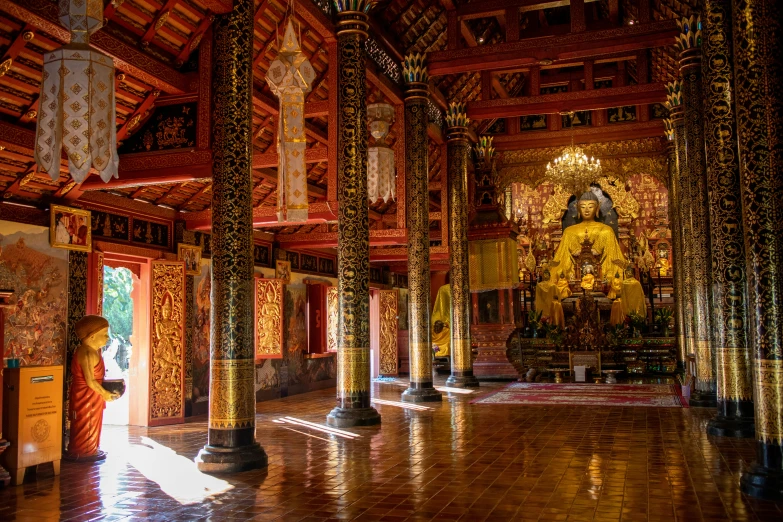 a temple with a large wooden floor and columns