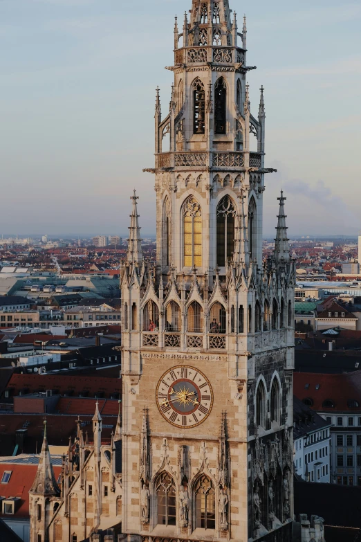 the tall clock tower has ornate carvings on it