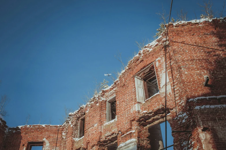 a close up of an old brick building with a window